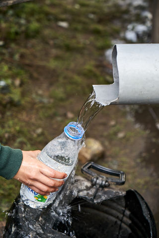Drinking water supply by a NGO in informal refugee camp. Subotica, Serbia
